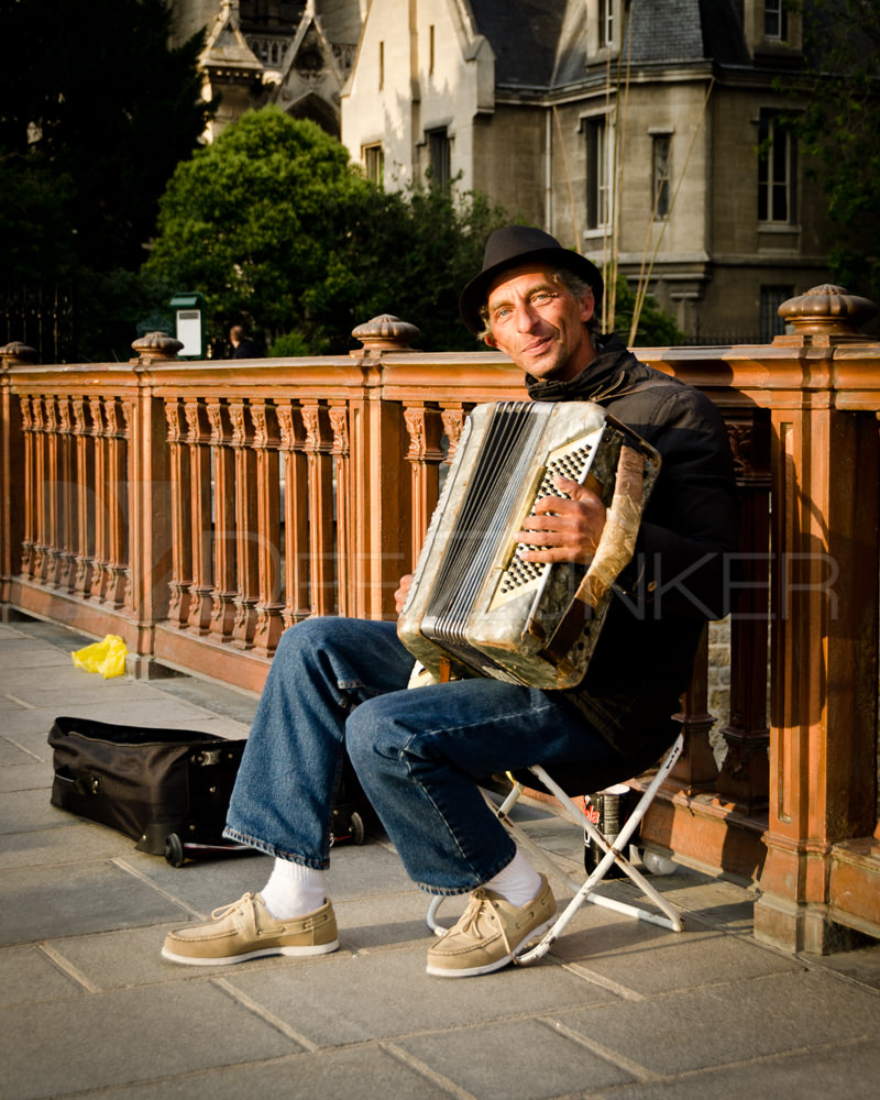 Paris Accordion Player by Notre Dame Houston Commercial Architectural Photographer Dee Zunker