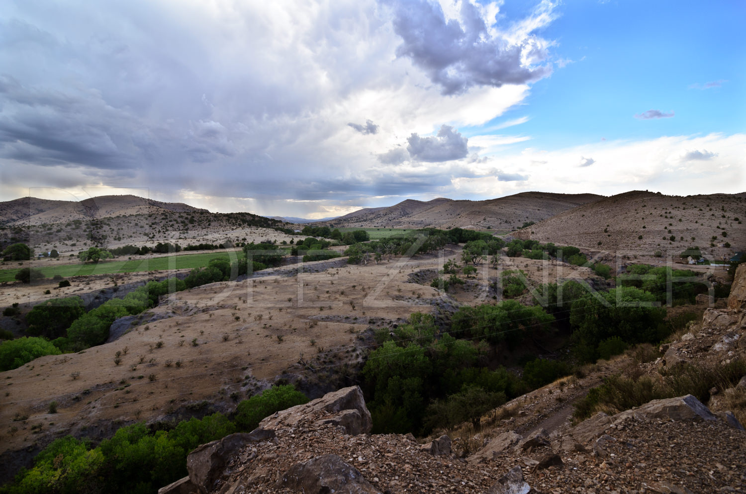 New Mexico Rain Storm in the distance by Houston Commercial Architectural Photographer Dee Zunker