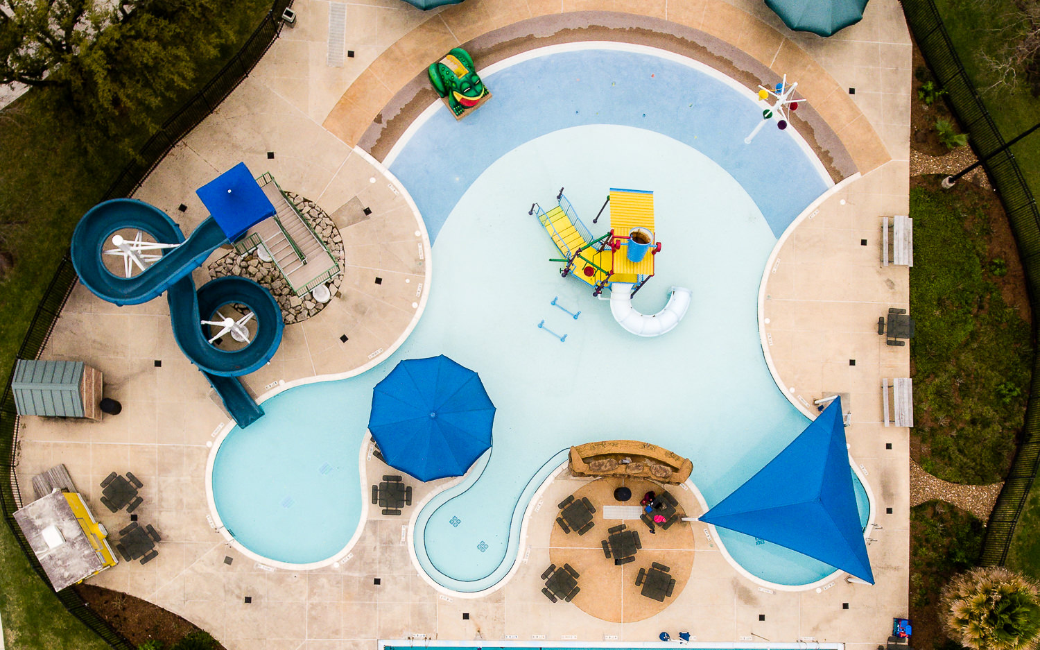 Overhead drone photo of the community pool in Bellaire, TX. The swimming lanes and pool layout are seen from a top-down perspective.