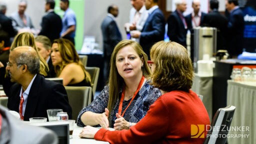 Two women networking at a convention in the George R Brown Convention Center in Downtown Houston