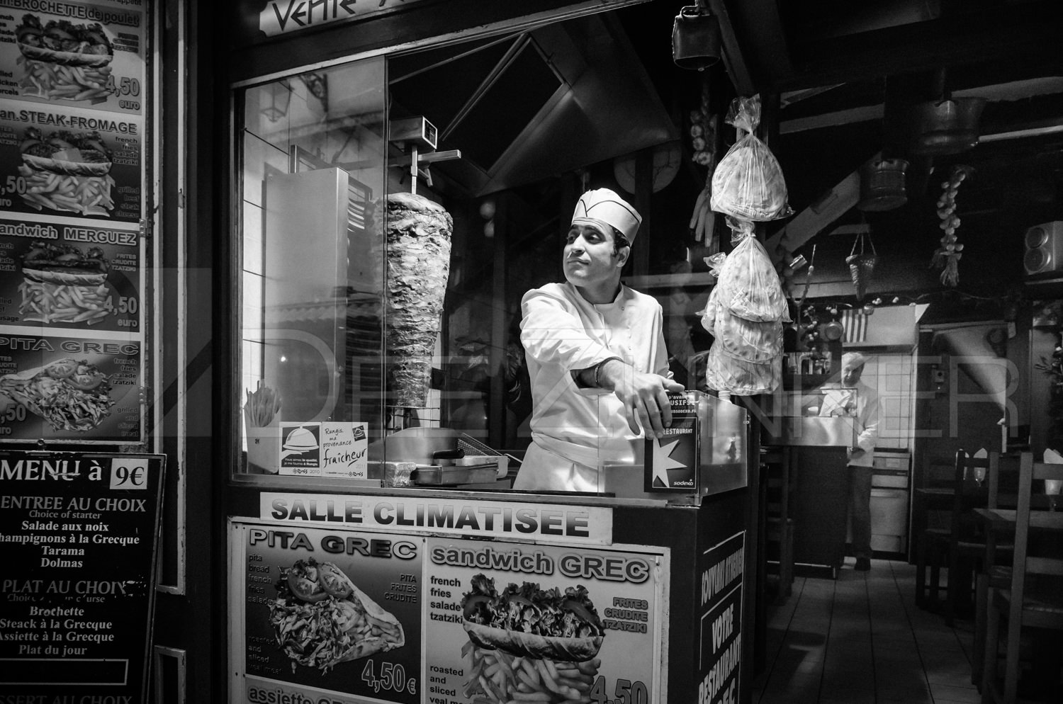 Greek Sandwich Vendor - Paris, 2011Awarded "Best in Show" 2013 HPS Annual CompetitionSelected by Sally Sprout for the VAA 32nd Juried Open Exhibition  Paris_Street_01.dng  Houston Commercial Architectural Photographer Dee Zunker