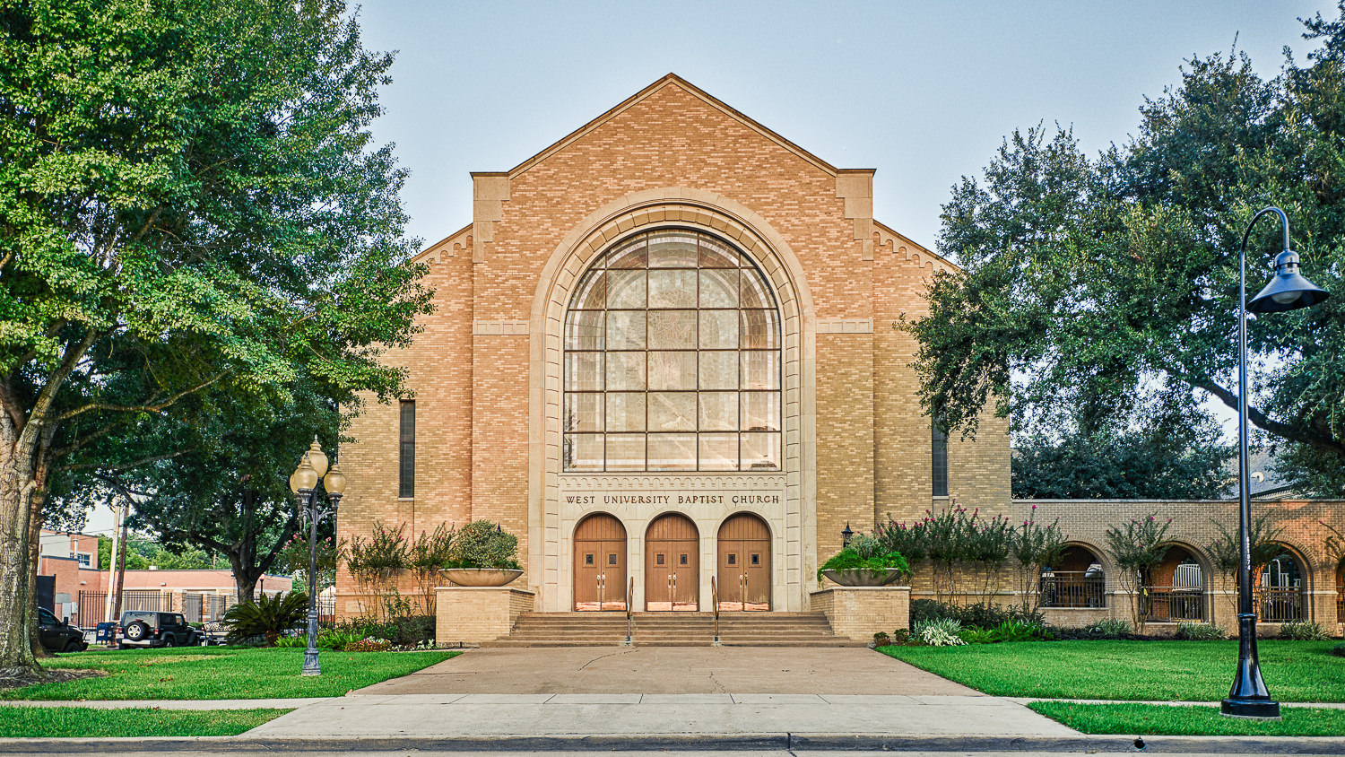 Front view of the West University Baptist Church sanctuary, highlighting the building's traditional religious and community-focused architecture.