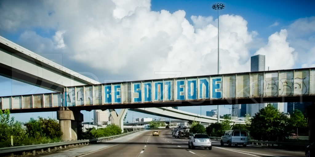 Be Someone Graffiti over I-45 just north of Downtown Houston by Architectural Commercial Photographer Dee Zunker