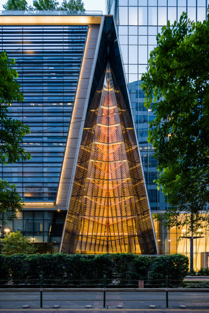 A close-up of modern architectural details on the glass exterior of an office building on Main Street in downtown Houston.