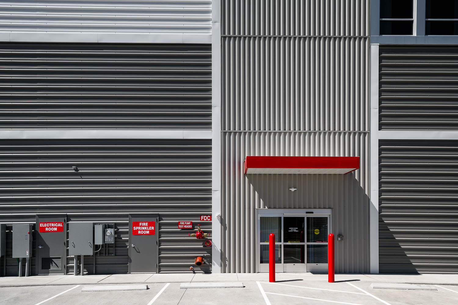 A close-up of the modern graphic patterns on the exterior panels of a new CubeSmart storage facility, built by ARCO Murray.