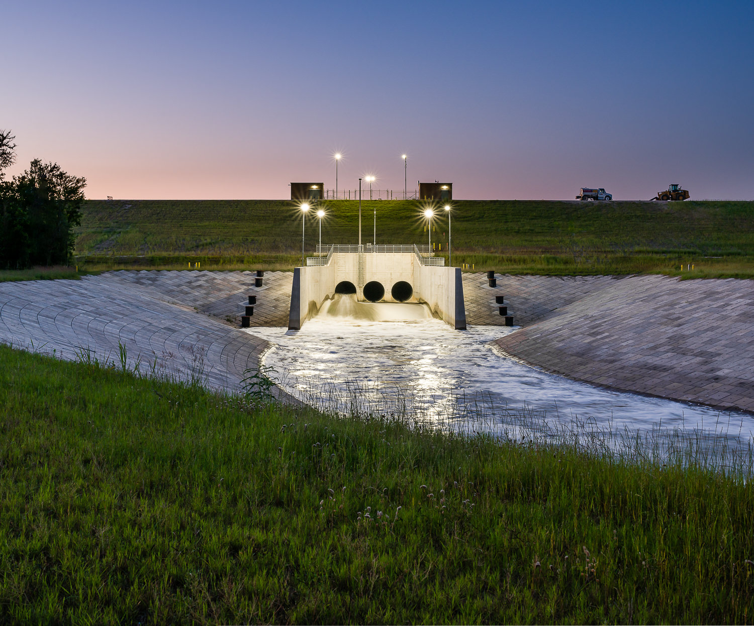 Infrastructure photography of downstream of Addicks Dam at twilight in Houston TX   