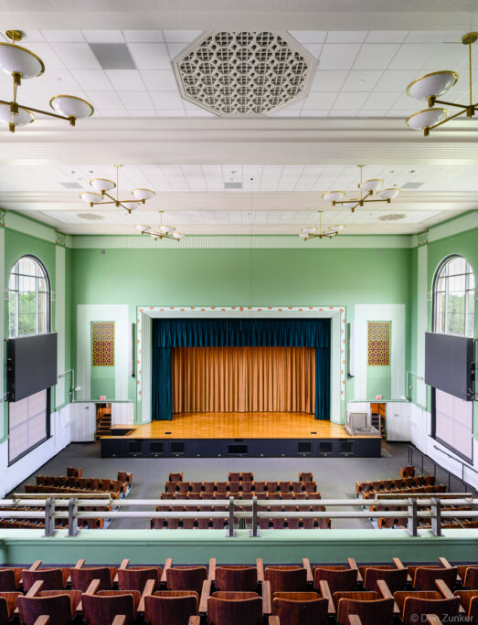 Interiors photography of the renovated auditorium at Houston's historic Austin High School, a major institutional restoration project.