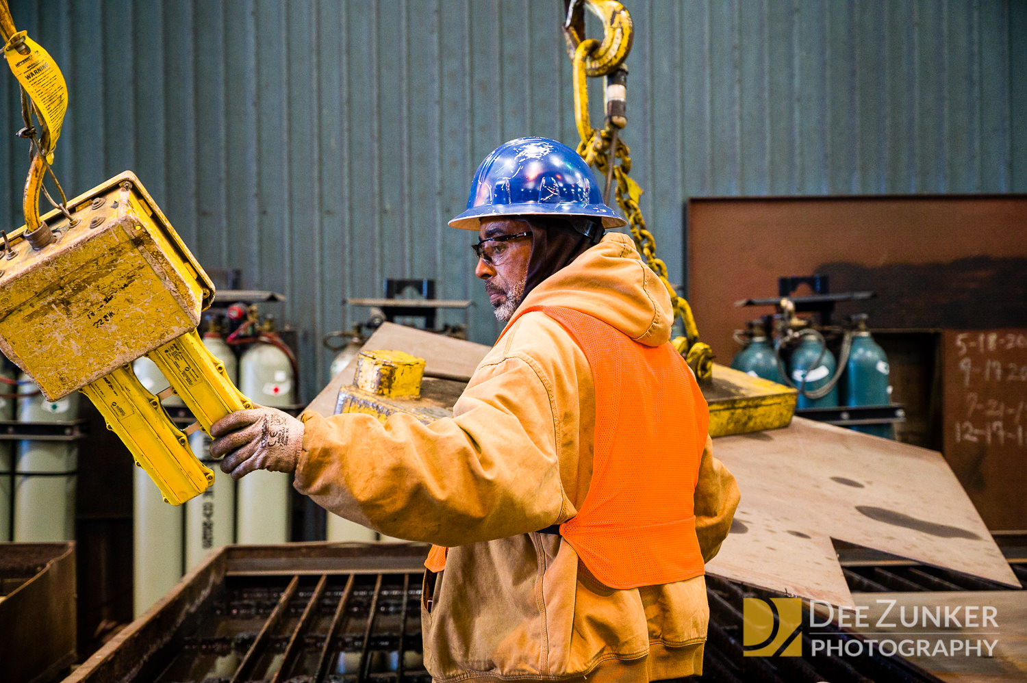 Industrial branding photography of worker in steel mill