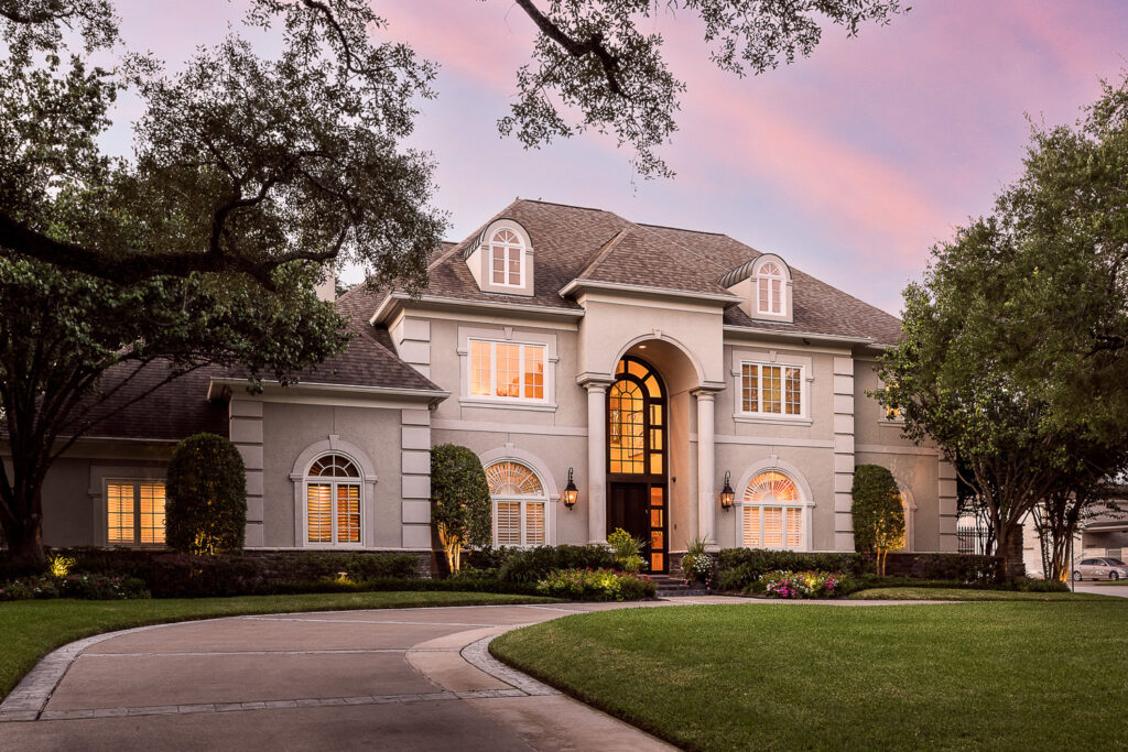 Luxury home exterior twilight architectural photography Bellaire Texas residential real estate