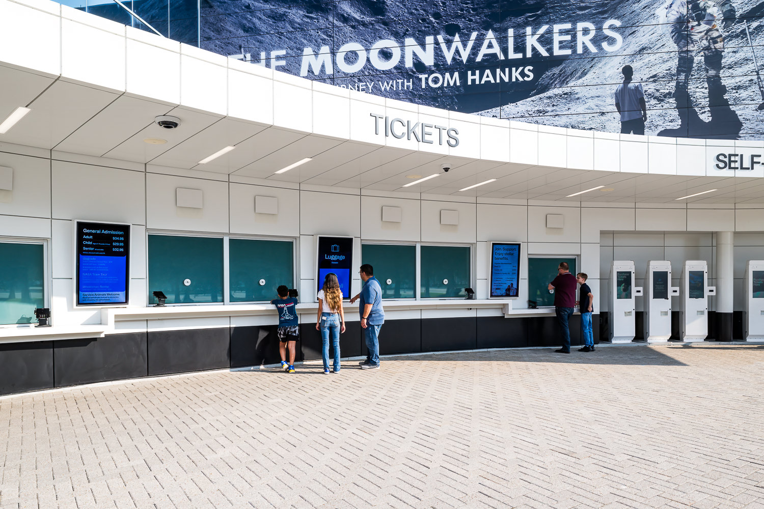Families get tickets at the new Space Center Houston ticket counter, an institutional architecture project by architect PGAL.