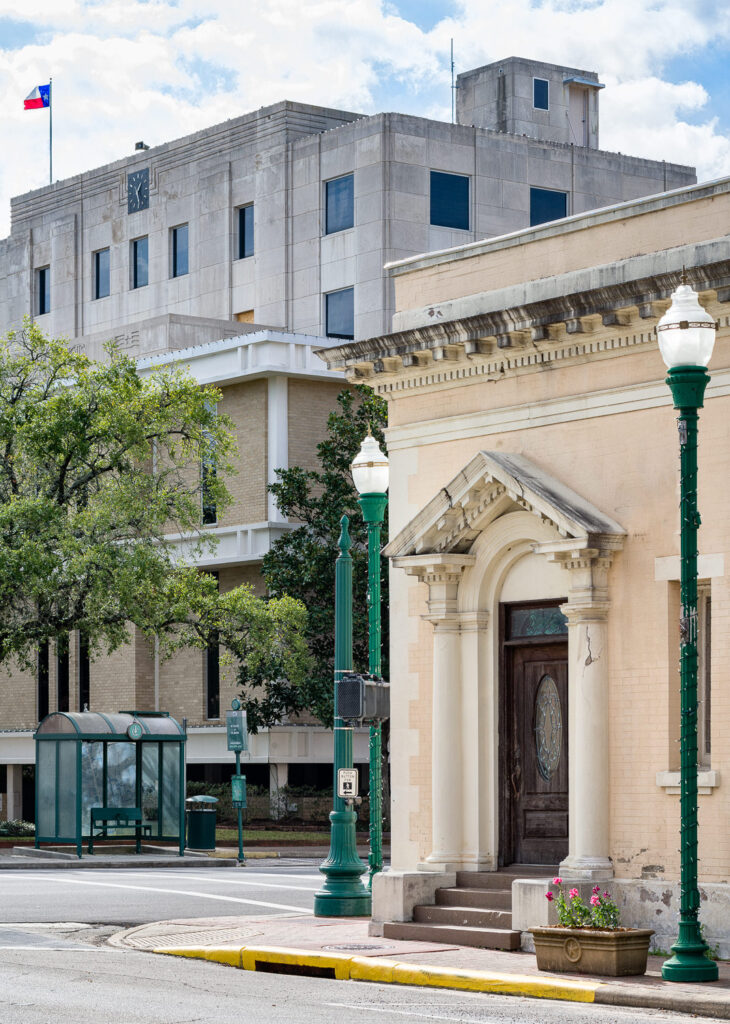 The historic facade of a law office building in downtown Conroe, Texas, located across the street from the Montgomery County Courthouse.