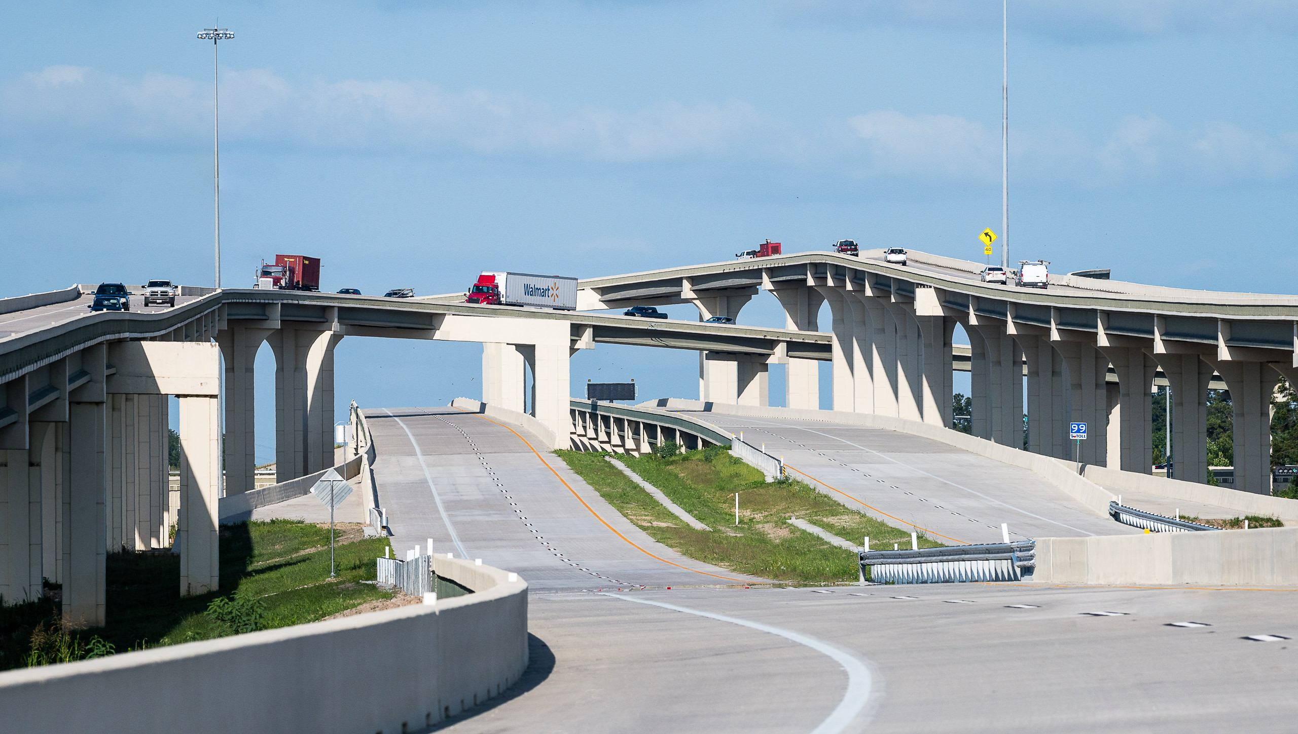 Ground-level photo of the Hwy 59 North and Hwy 99 interchange, shot from a closed section before the new construction opened.