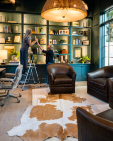 Interior Designers making the final touches in a renovated library
