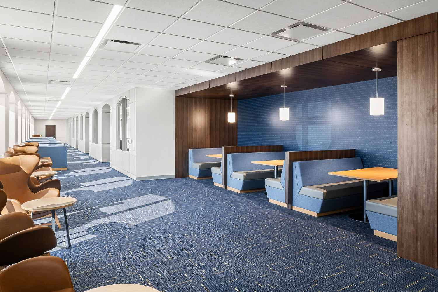 Architectural interior of a student work area in the Second Baptist School library, a modern institutional and educational space in Houston, TX.