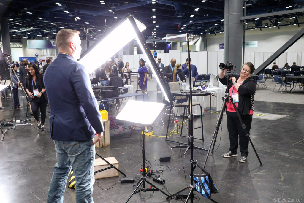 Giving Direction at dual headshot station at george R Brown Convention Center in downtown Housotn, TX