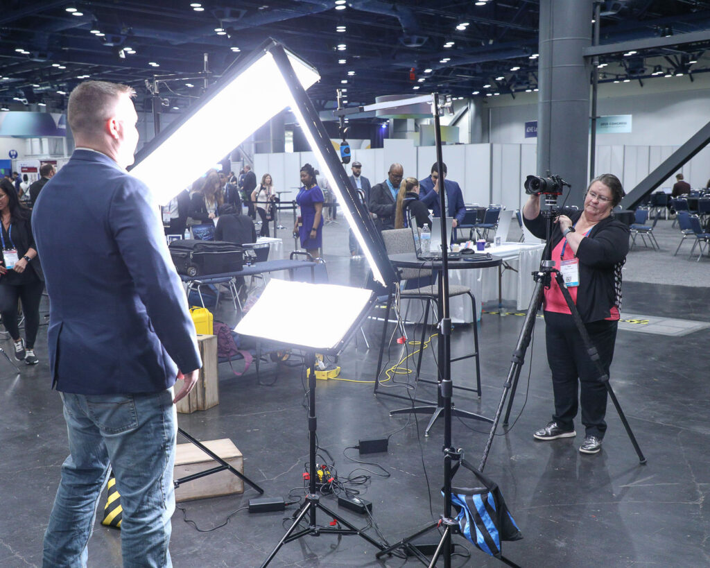 Giving Direction at dual headshot station at george R Brown Convention Center in downtown Housotn, TX
