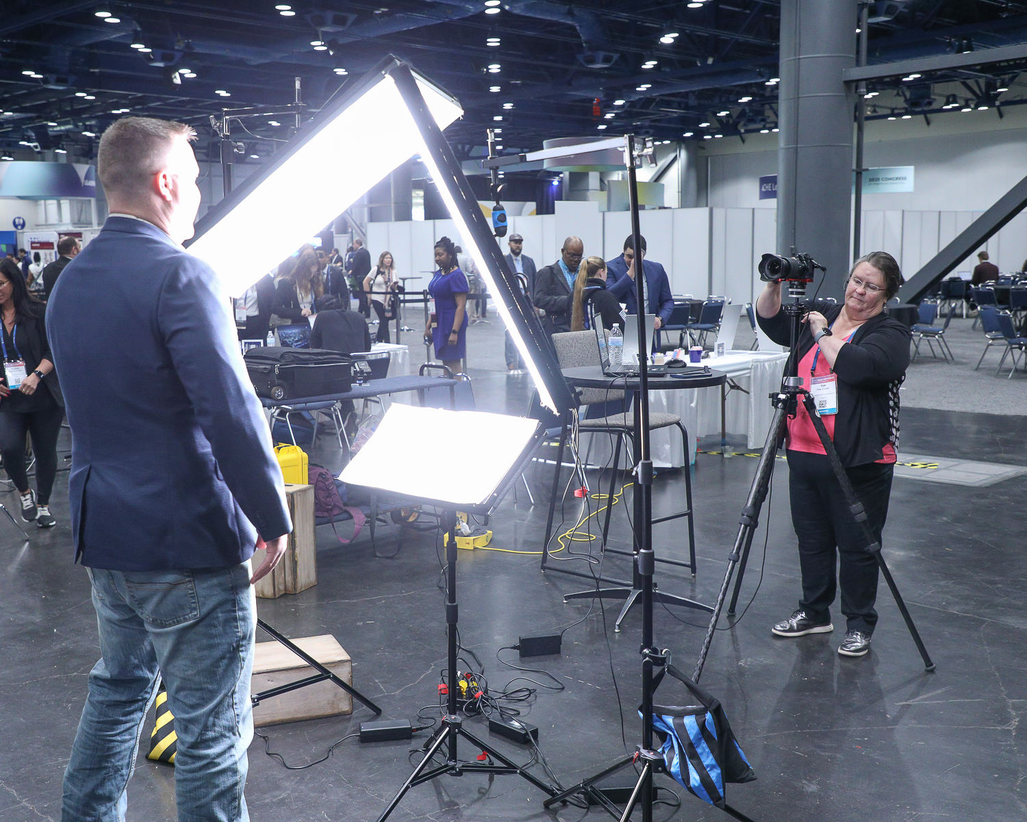 Giving Direction at dual headshot station at george R Brown Convention Center in downtown Housotn, TX