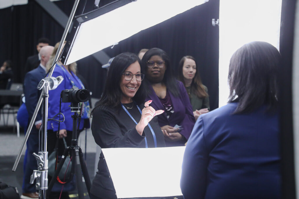 Expression coaching at headshot station at george R Brown Convention Center in downtown Housotn, TX