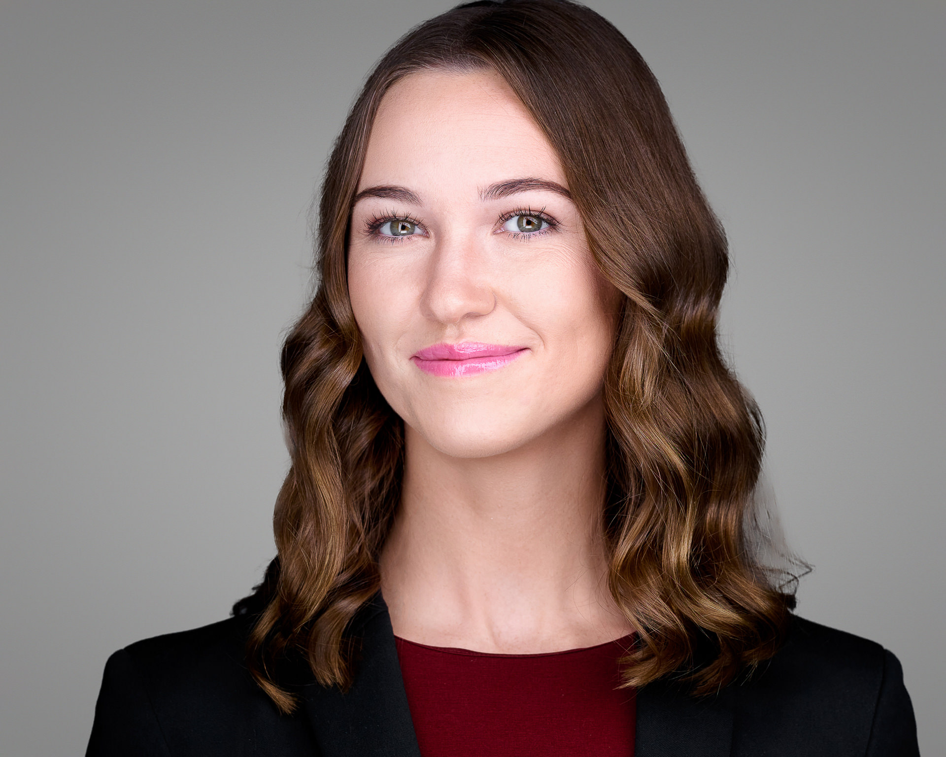 Female professional headshot on light gray background