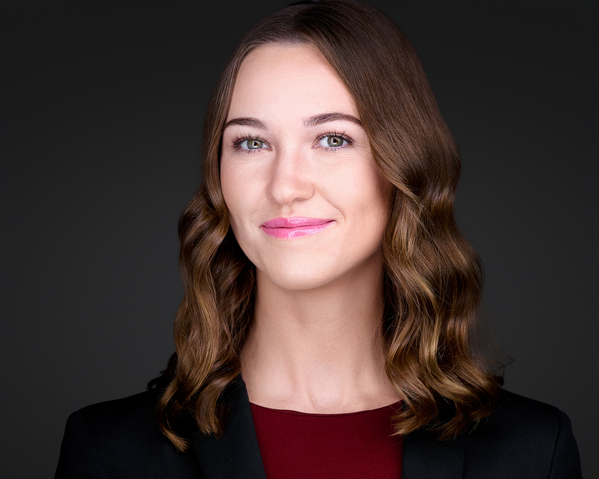 Female professional headshot on black background