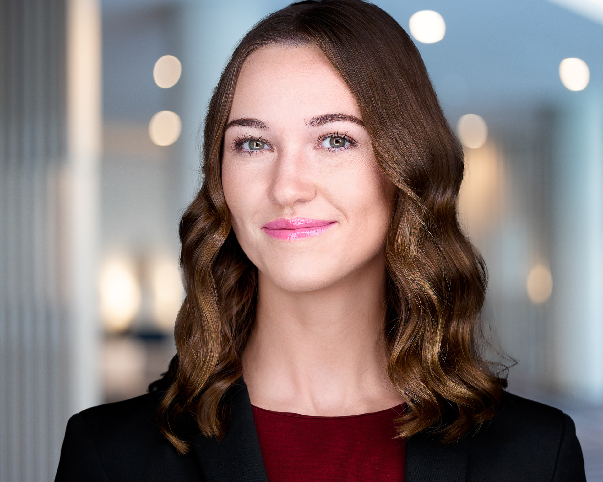 Female professional headshot on conference background