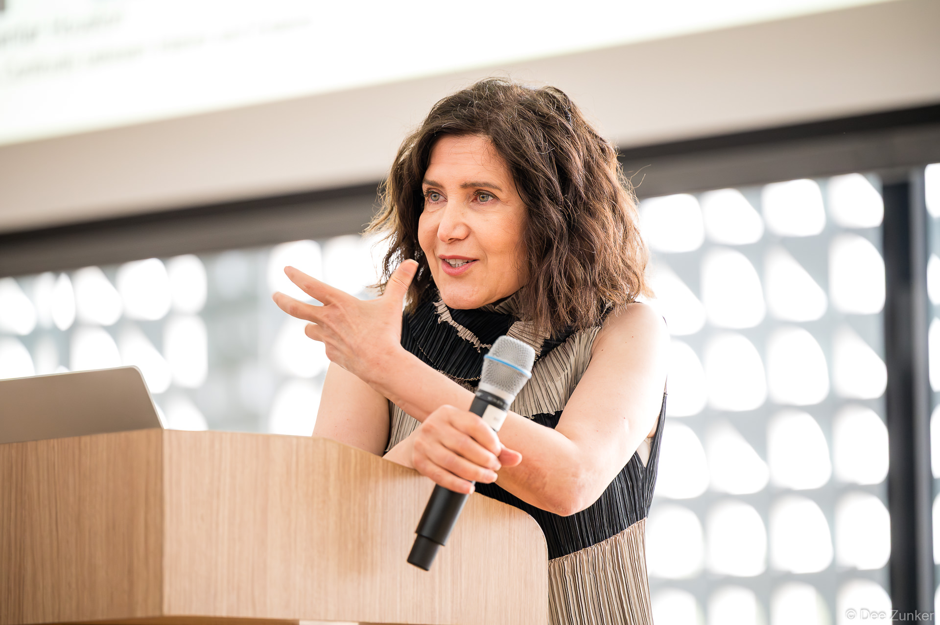 Architect Farshid Moussavi speaks at podium during Gulf Coast Green 2026 opening keynote at The Ismaili Center, Houston.
