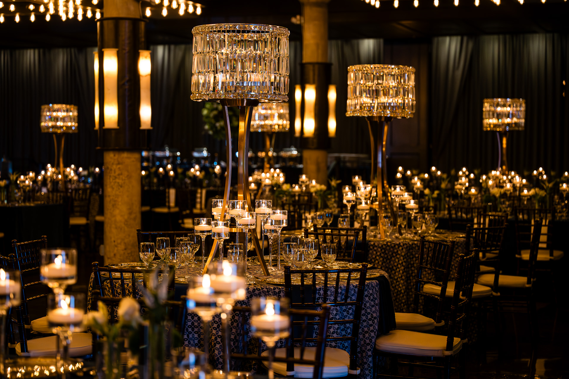 Houston corporate gala ballroom with crystal chandeliers and formal table settings at The Astoria