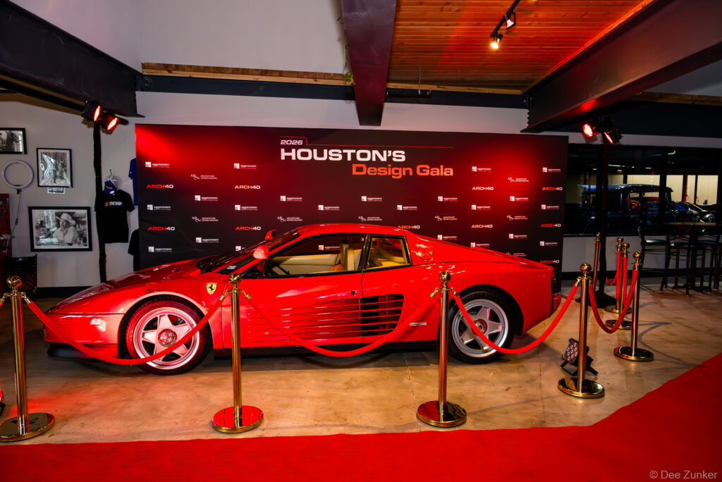 Red Ferrari Testarossa on display behind velvet rope at the 2026 AIA Houston Design Gala hosted at The Shop Club Houston.