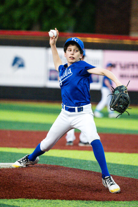 Young Royals pitcher delivers from the mound during a Bellaire Little League American League game at Weston or Tiras Field in Bellaire TX.