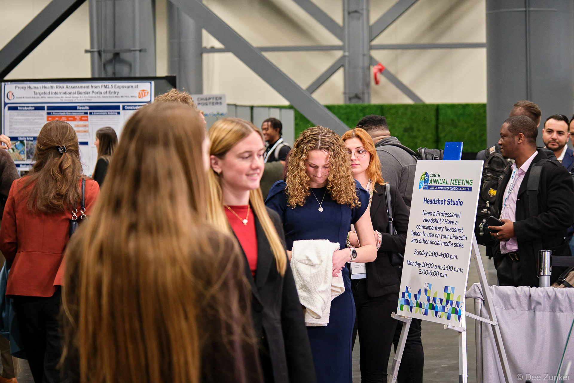 Conference attendees engaging with a headshot booth activation at George R. Brown Convention Center Houston during an annual meeting.