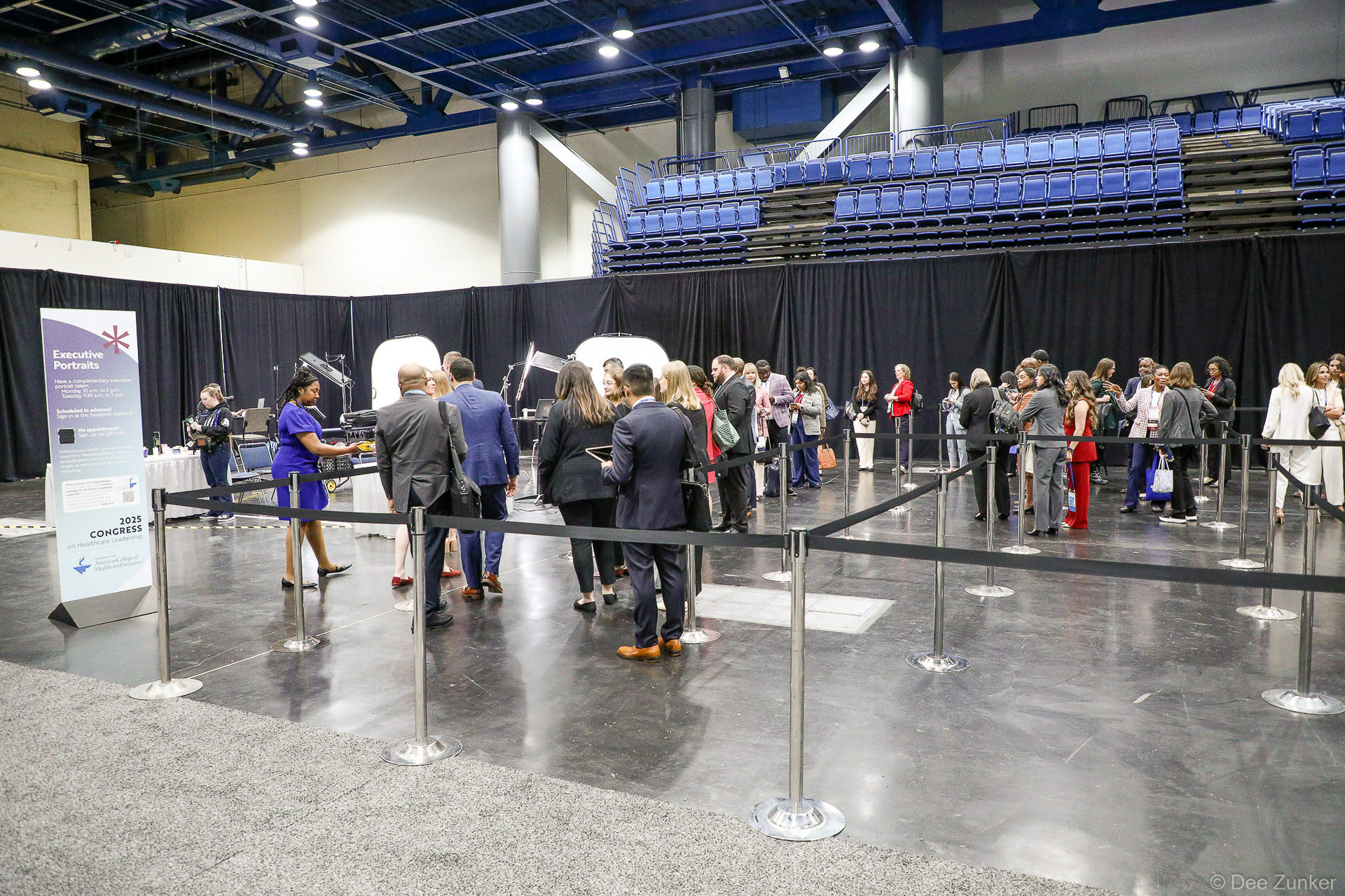 Professionals queue at an Executive Portraits booth during the event, photographed by Dee Zunker Photography at a Houston convention venue.