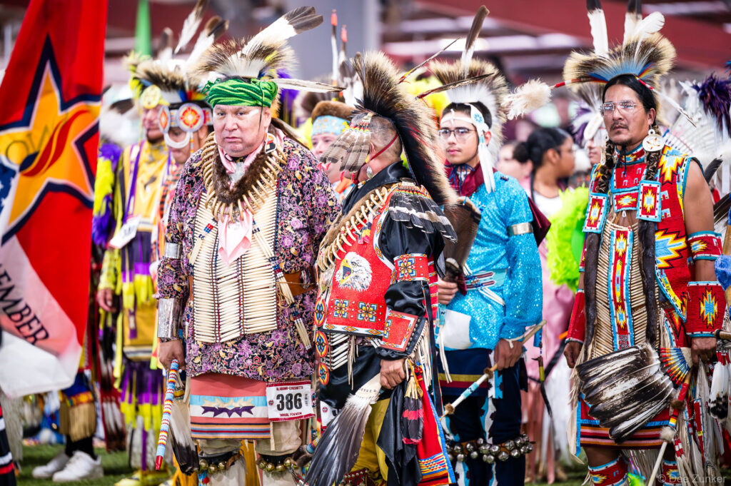 Native American dancers in traditional regalia during Grand Entry at the Alabama-Coushatta 56th Annual Powwow, Livingston, Texas.