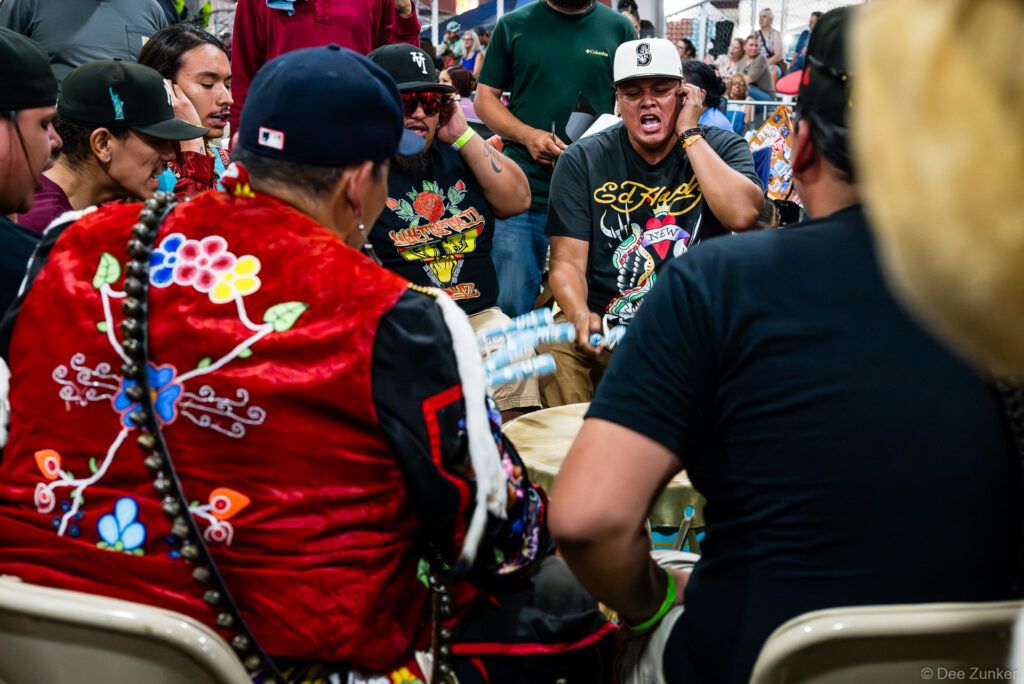 Drum group performers singing and playing traditional drum at the Alabama-Coushatta 56th Annual Powwow in Texas.