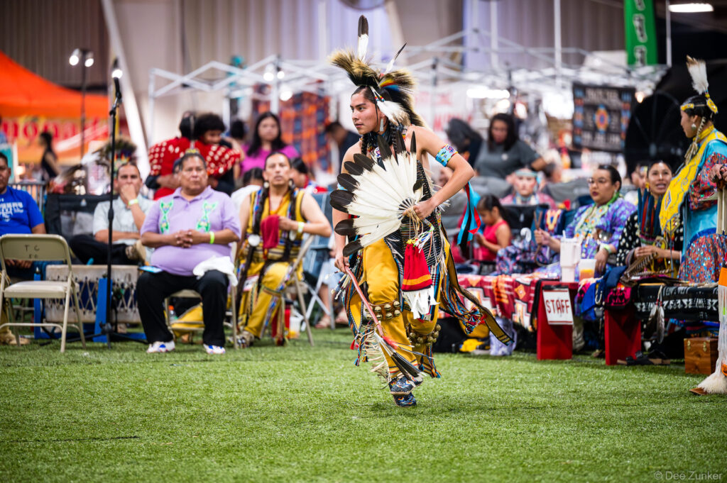 Native American male dancer in traditional regalia performing at the Alabama-Coushatta 56th Annual Powwow in Texas