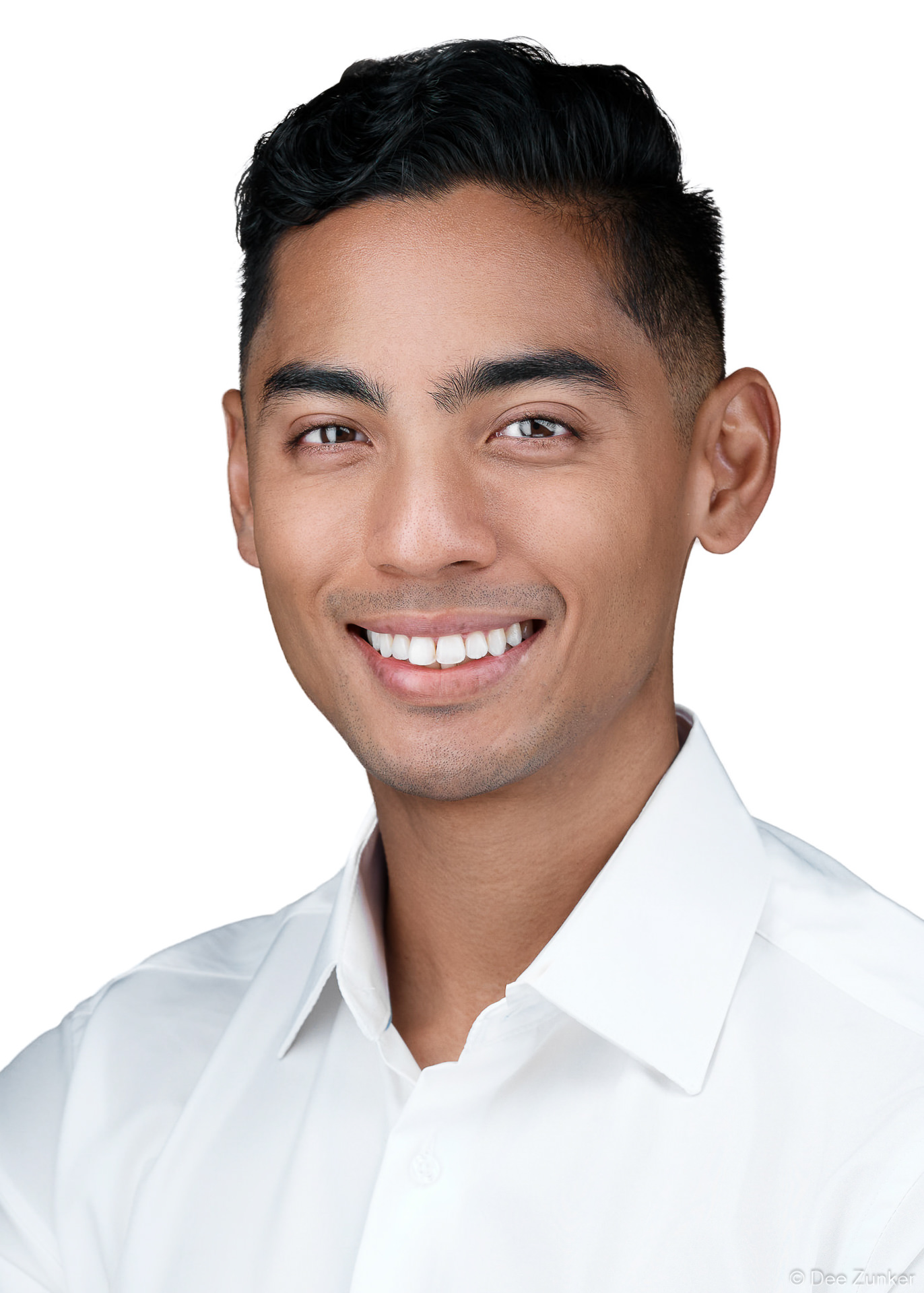Smiling young man in white dress shirt, clean white background ERAS residency applicant headshot in 5x7 format, Houston TX.