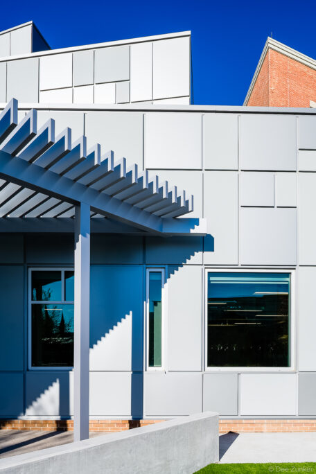 Exterior metal panel facade with pergola canopy at River Oaks Baptist School addition, Houston architectural photography by Dee Zunker