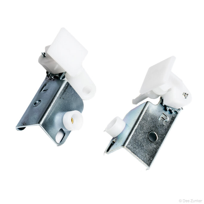 Pair of steel mounting brackets with white nylon roller components, shot on white background for industrial catalog product photography.