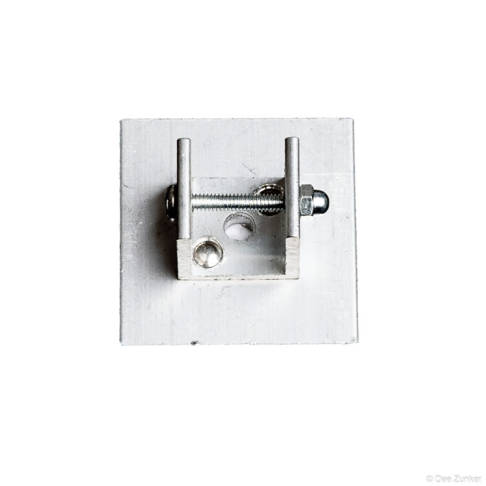 Aluminum mounting bracket with threaded rod and hex nuts photographed on white background for industrial catalog product photography.