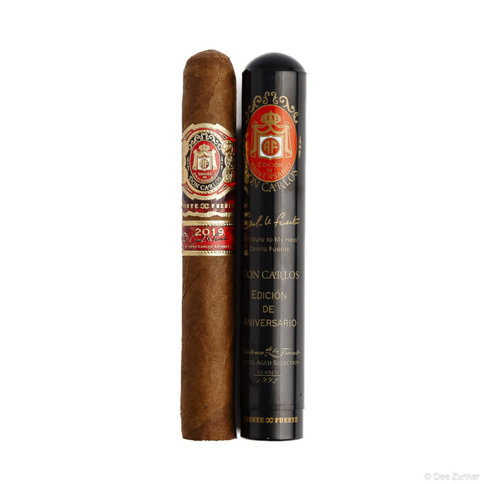 Arturo Fuente Don Carlos 2019 Edicion de Aniversario cigar and black tube on white background, Houston retail product photography.