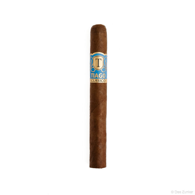 Tiago Clasico premium cigar with blue and gold band on white background, Houston retail product photography by Dee Zunker Photography.