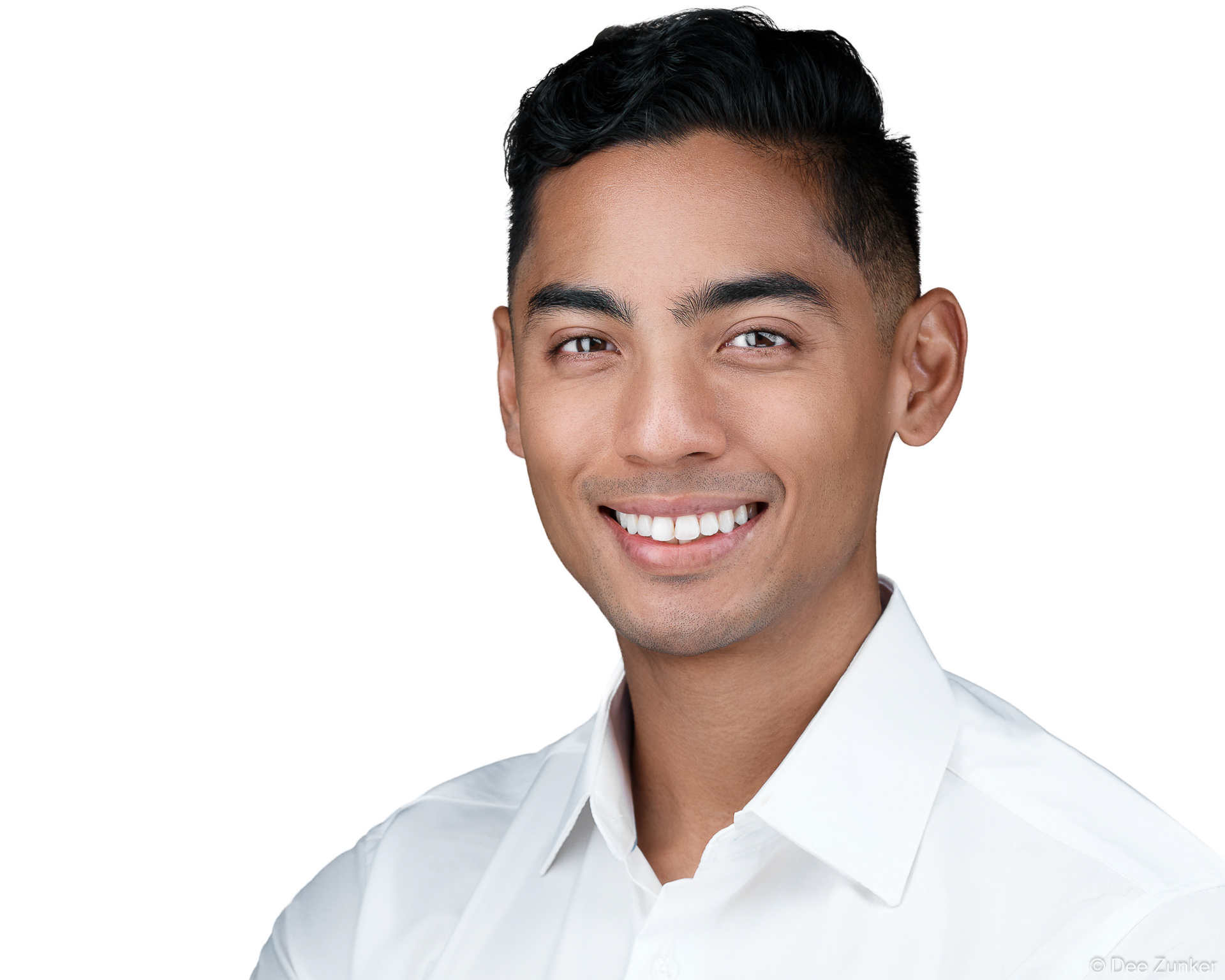 Smiling young man in white dress shirt, clean white background corporate headshot, professional staff portrait photography Houston TX.