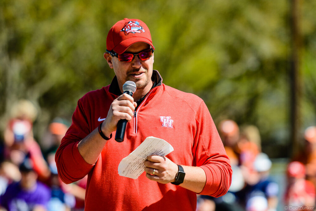 Coach or official speaks into microphone at Bellaire Little League Opening Day 2016 corporate event photography Houston TX