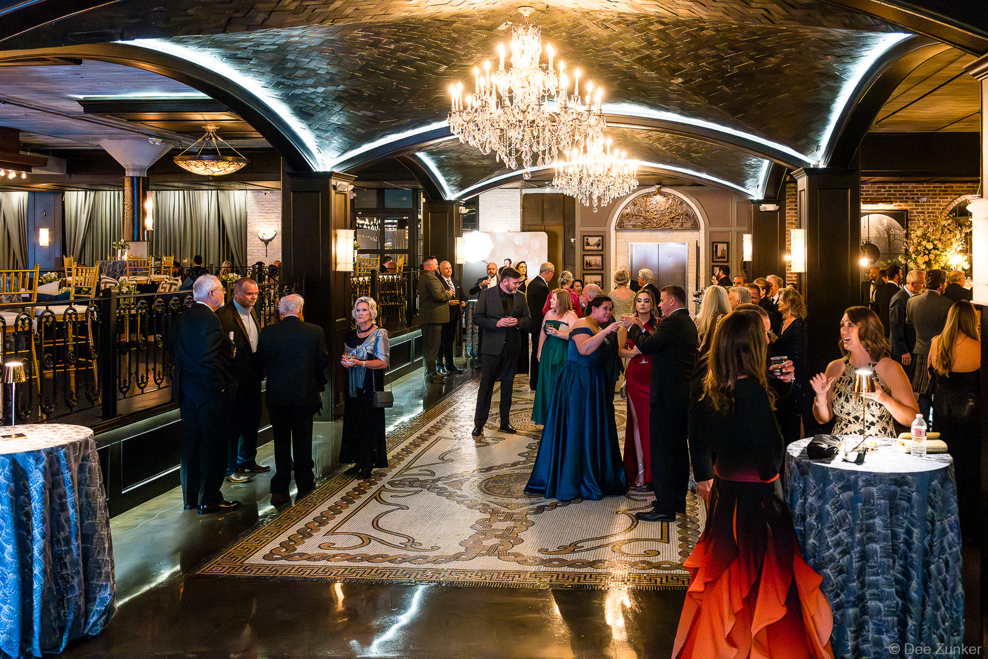 Guests in formal attire at Houston corporate anniversary gala celebration