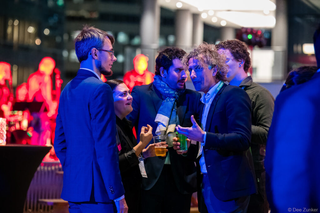 Corporate event attendees network and converse at INTA Lead opening reception, photographed by Houston commercial event photographer.