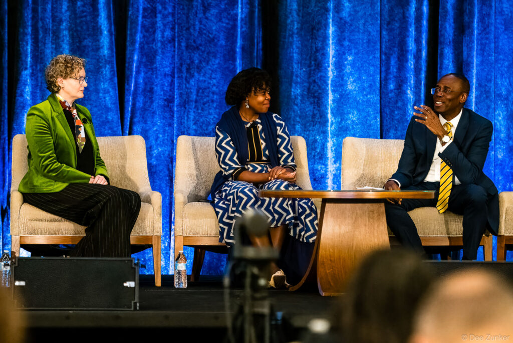 Three panelists seated on stage during INTA Leadership Meeting WIPO keynote session, Houston conference photography by Dee Zunker.