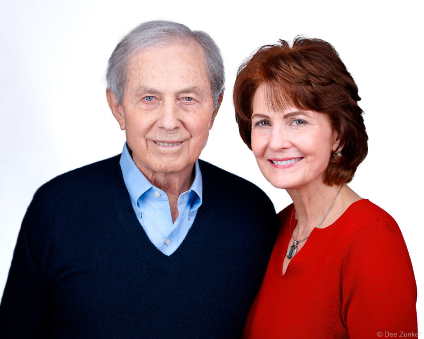 Professional couples portrait of an older man and woman smiling, corporate headshot session in Bellaire TX